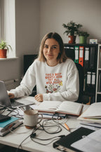 White crewneck sweatshirt with floral inspirational text graphic on the front