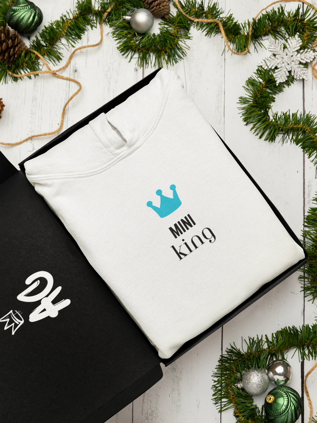White hooded sweatshirt with blue crown and 'Mini king' text on chest
