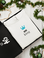White hooded sweatshirt with blue crown and 'Mini king' text on chest