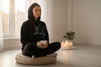 Black yoga lotus pose hoodie with front hood and printed meditation graphic