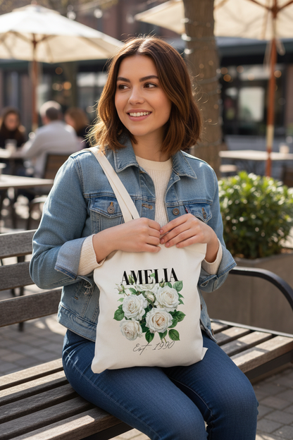 Young woman sitting with smaller AMELIA tote