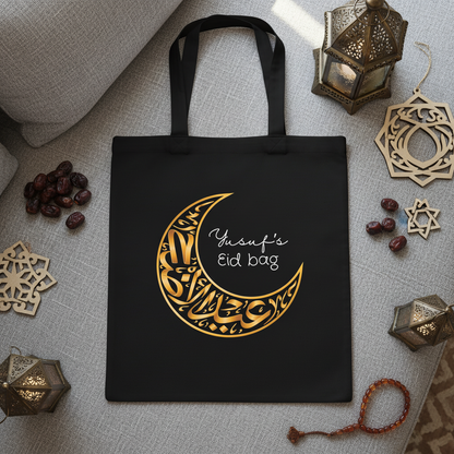 Yusuf's Eid Bag - Black Tote Flatlay on Sofa with Eid Decorations