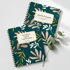 Teal spiral notebooks with botanical leaf covers and beige personalized name tags