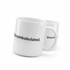 Two white mugs: one says “Discombobulated.”, the other says “Overstimulated.”