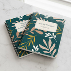 A5 spiral notebook with teal leaf patterned cover and overlapping white title labels